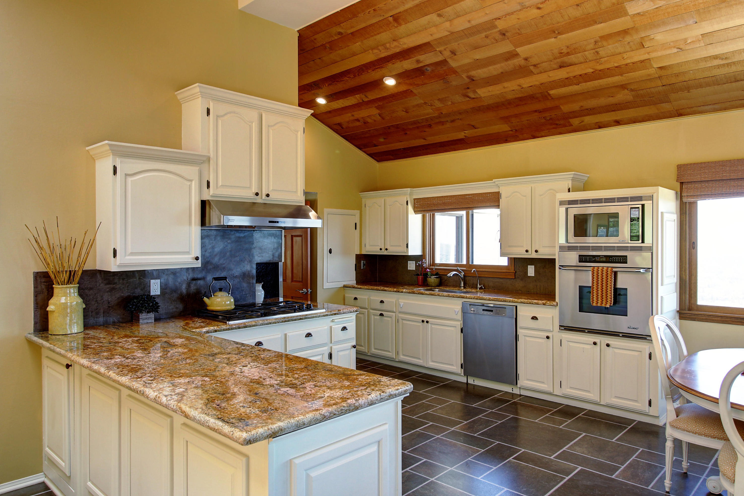 1710 Mission Ridge Road Santa Barbara, CA 93103 - Photo 8 of 27 a kitchen with stainless steel appliances granite countertop a stove sink and cabinets