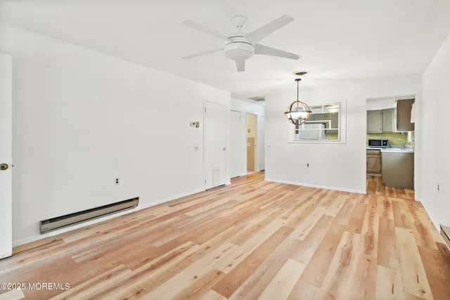 a kitchen with a refrigerator sink and cabinets