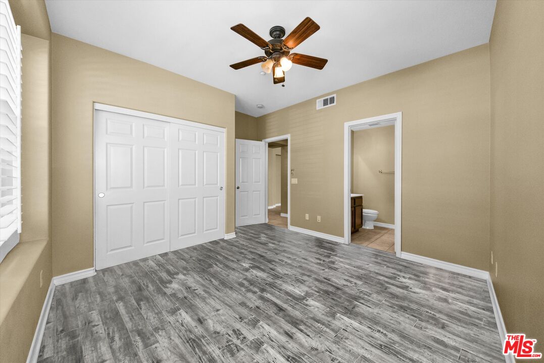 5611 Scharf Avenue Fontana, CA 92336 - Photo 20 of 49 a view of empty room with wooden floor
