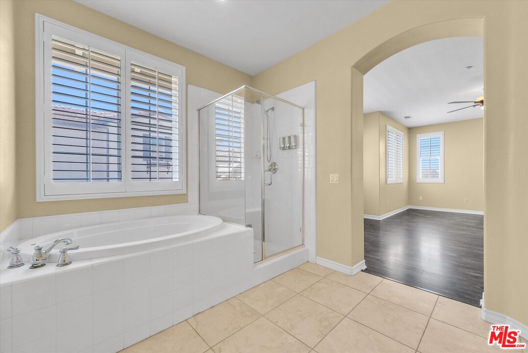 5611 Scharf Avenue Fontana, CA 92336 - Photo 26 of 49 a bathroom with a bathtub and a sink