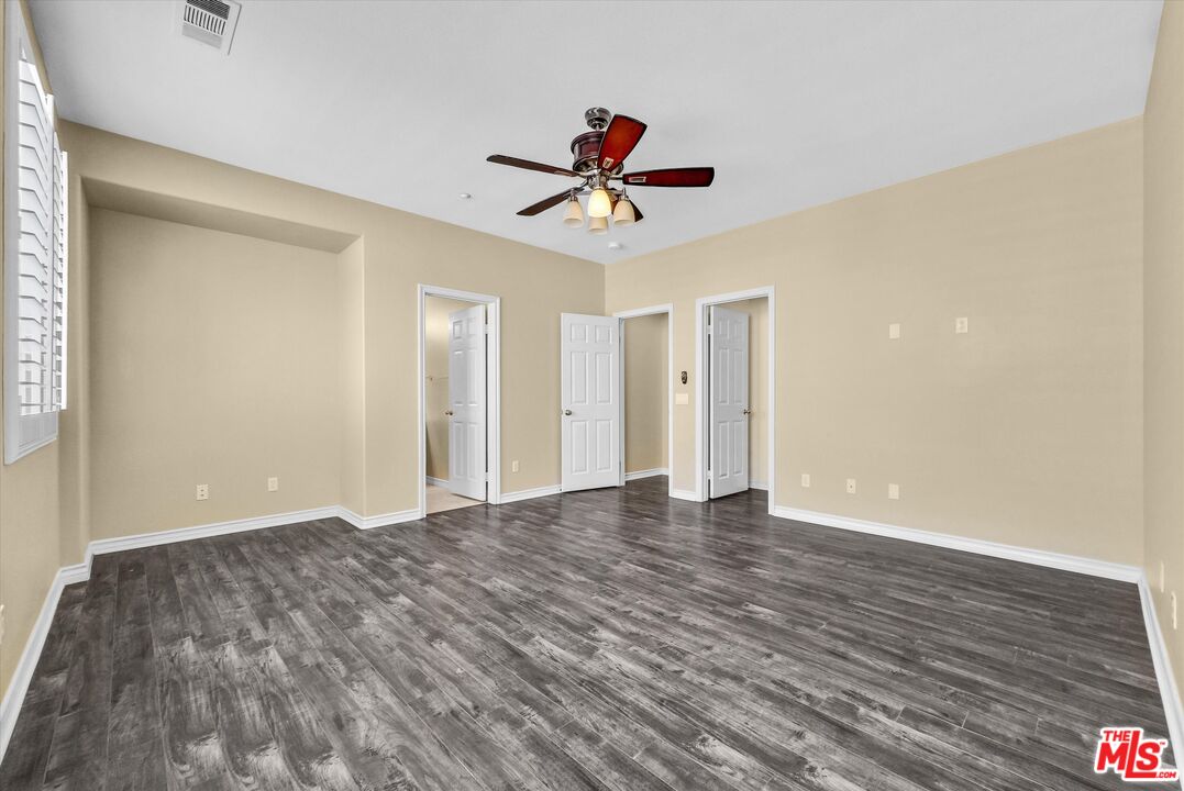 5611 Scharf Avenue Fontana, CA 92336 - Photo 31 of 49 a view of empty room with wooden floor