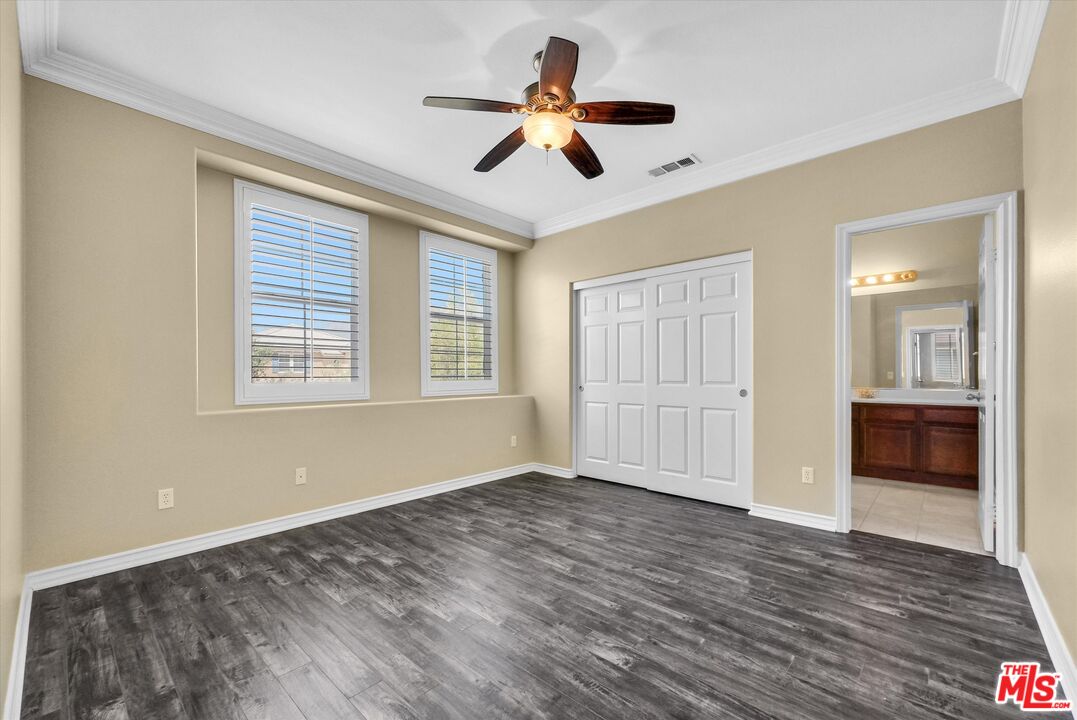 5611 Scharf Avenue Fontana, CA 92336 - Photo 33 of 49 a view of an empty room with a window and wooden floor