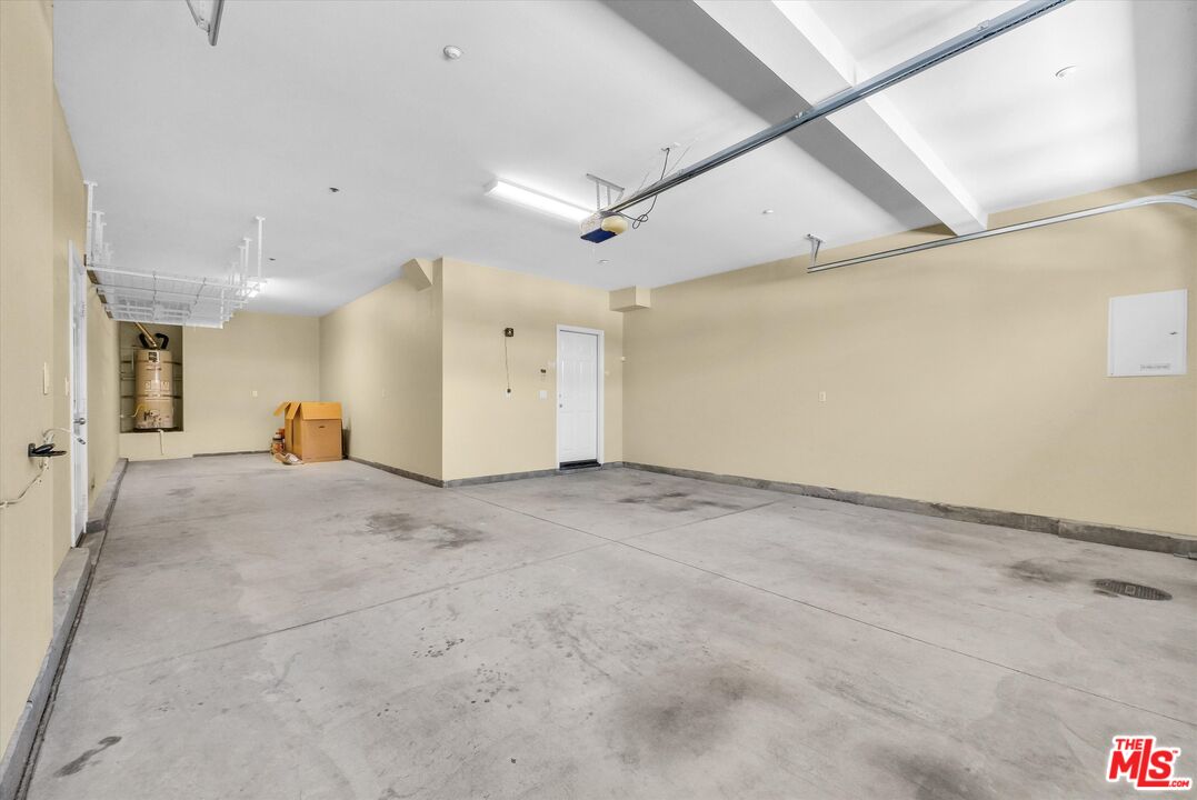 5611 Scharf Avenue Fontana, CA 92336 - Photo 39 of 49 a view of a livingroom with furniture and a ceiling fan