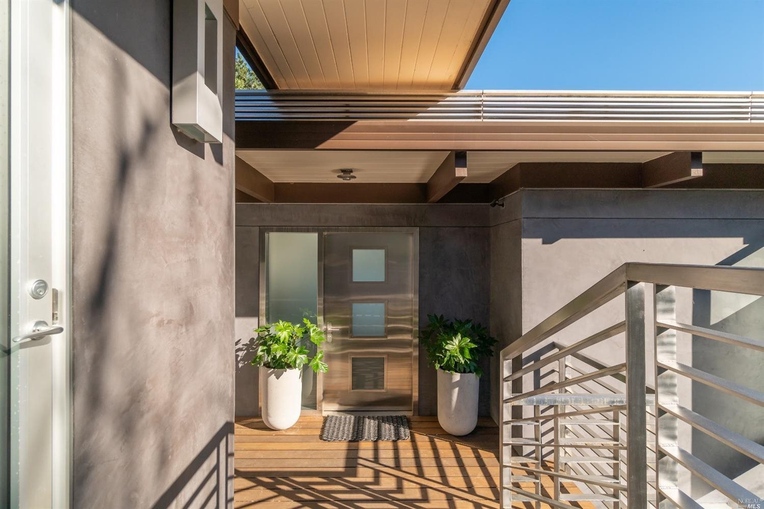 a potted plant sitting on the side of a building