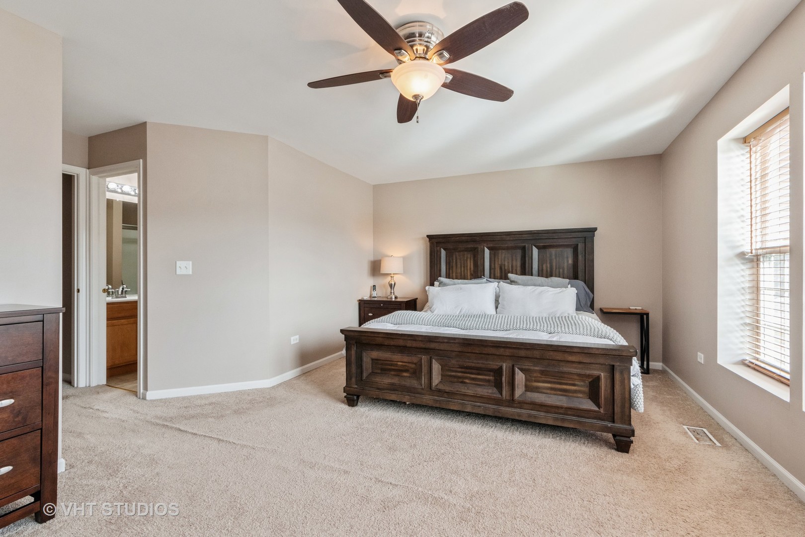 15320 Pinewood Road Lockport, IL 60441 - Photo 14 of 22 a bedroom with a bed and a ceiling fan