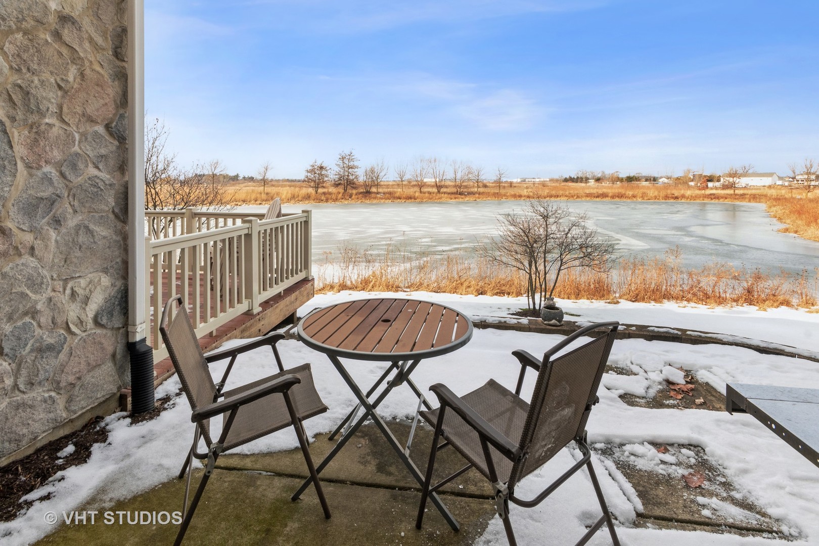 15320 Pinewood Road Lockport, IL 60441 - Photo 21 of 22 a view of a chairs and table on wooden deck with lake view
