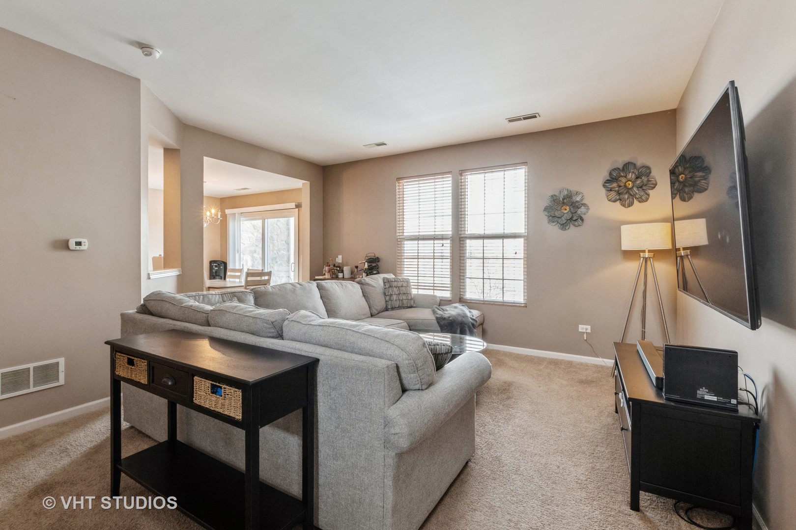 15320 Pinewood Road Lockport, IL 60441 - Photo 4 of 22 a living room with furniture a flat screen tv and a window