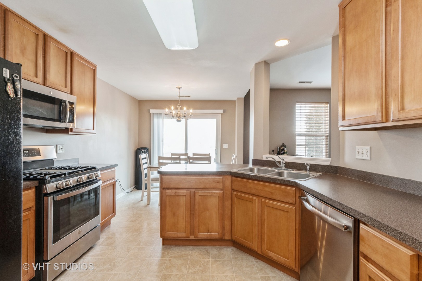 15320 Pinewood Road Lockport, IL 60441 - Photo 9 of 22 a kitchen with stainless steel appliances a sink stove and cabinets