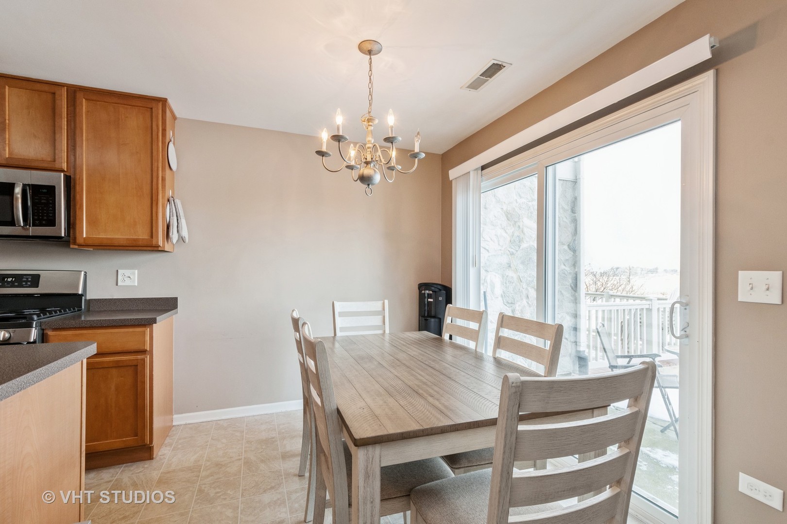 15320 Pinewood Road Lockport, IL 60441 - Photo 10 of 22 a view of a dining room with furniture window and outside view