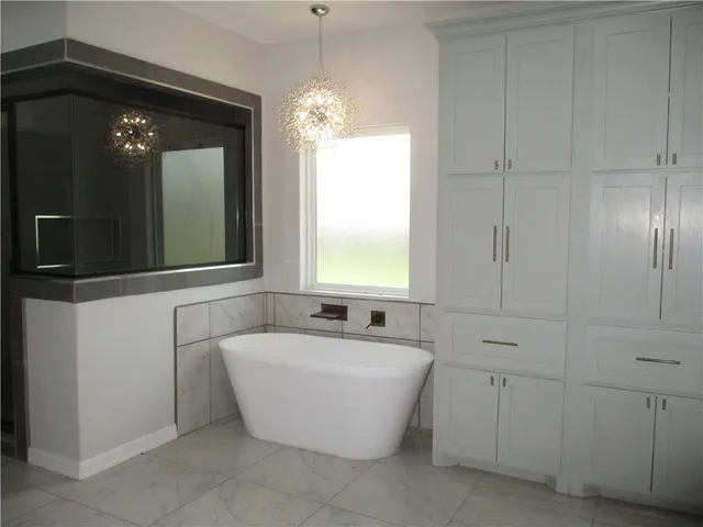 a bathroom with a bathtub and a sink