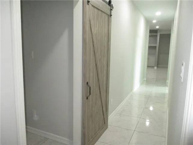 a view of hallway with shower