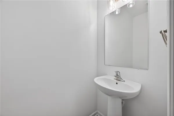 a bathroom with a sink and mirror