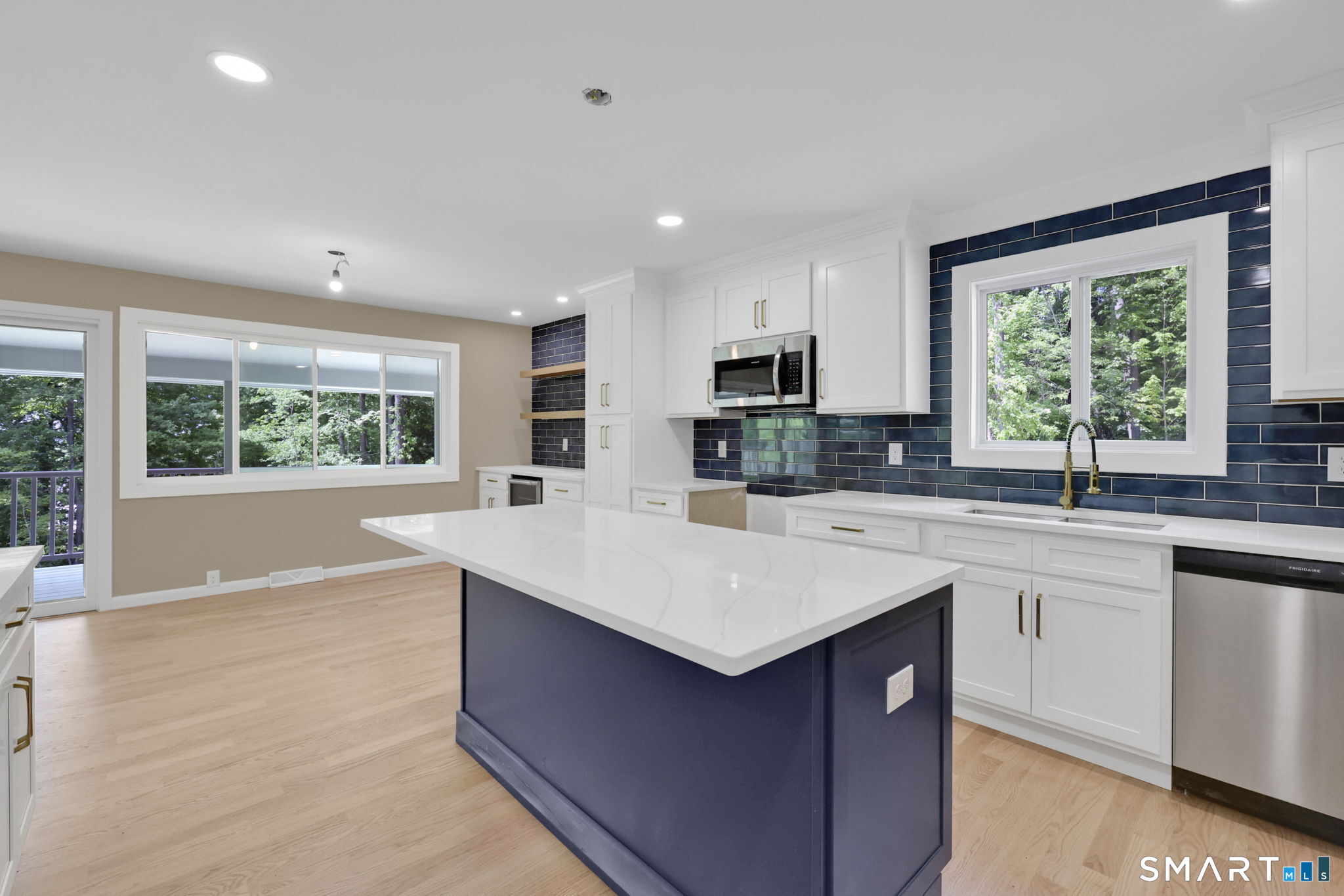 49 Millstone Road Glastonbury, CT 06033 - Photo 5 of 39 a kitchen with kitchen island granite countertop a sink appliances and a counter top space