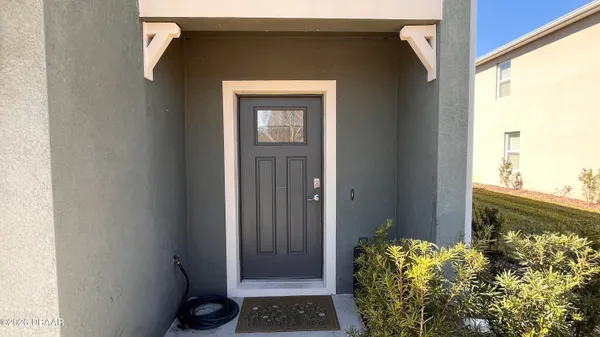 a view of a door and a window