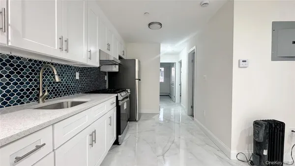 a view of a kitchen with a sink