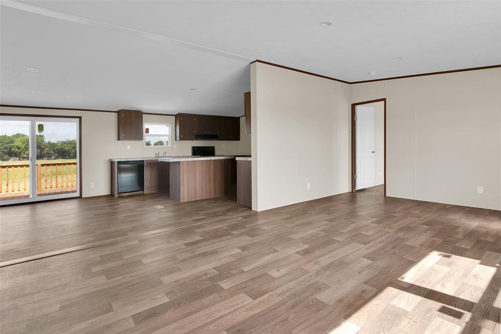 1223 Old Ida Road Sherman, TX 75090 - Photo 7 of 20 a view of a kitchen with a sink a refrigerator and window