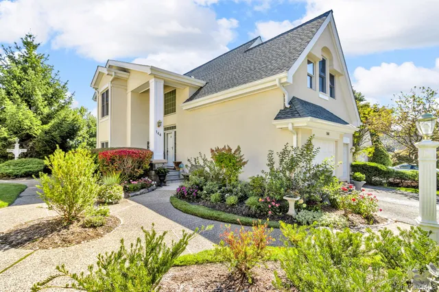a front view of a house having a yard