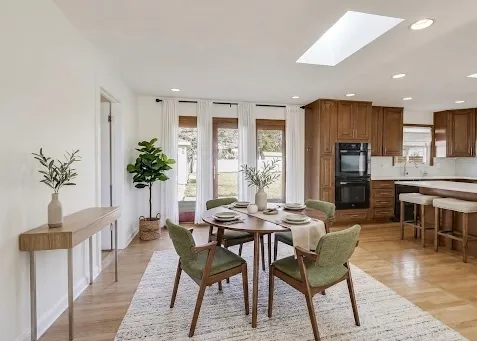 a view of a dining room with furniture and window