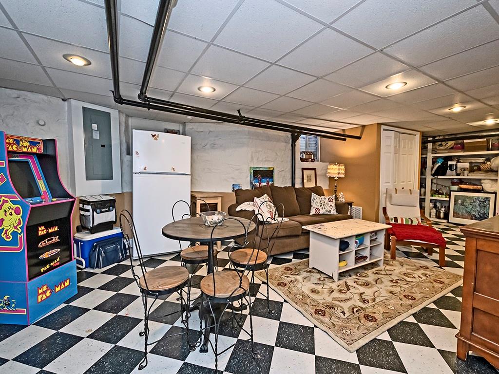 606 Bower Hill Road Pittsburgh, PA 15243 - Photo 15 of 24 a work room with furniture and a book shelf