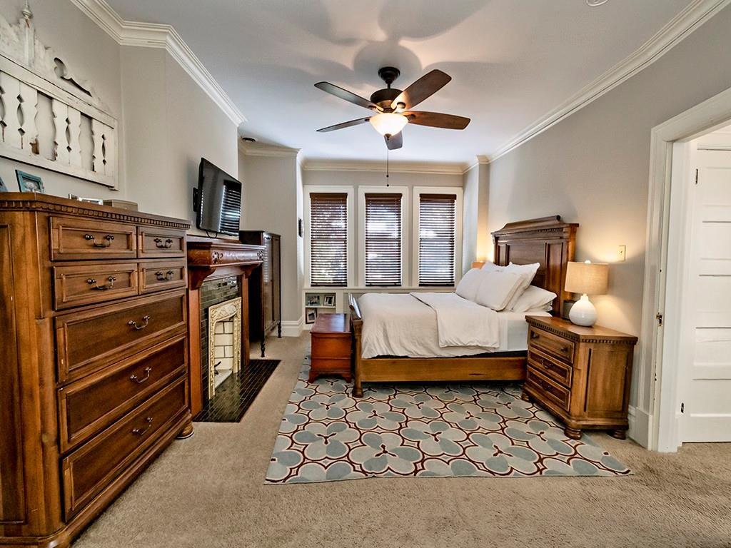 606 Bower Hill Road Pittsburgh, PA 15243 - Photo 17 of 24 a bedroom with a bed and a chandelier