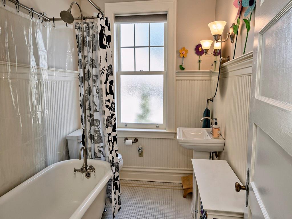 606 Bower Hill Road Pittsburgh, PA 15243 - Photo 23 of 24 a bathroom with a bathtub and a window
