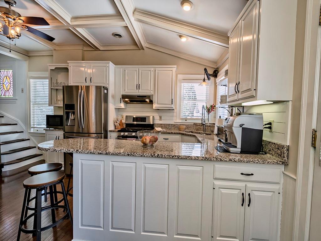 606 Bower Hill Road Pittsburgh, PA 15243 - Photo 10 of 24 a kitchen with stainless steel appliances granite countertop a sink stove and refrigerator