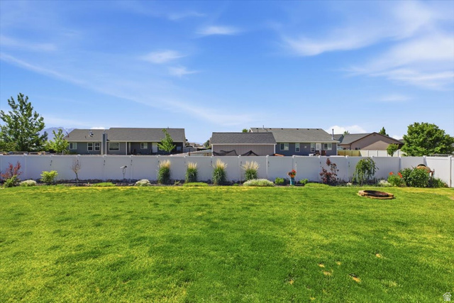 772 East 600 South Preston, ID 83263 - Photo 32 of 35 Expansive green lawn with a white privacy fence