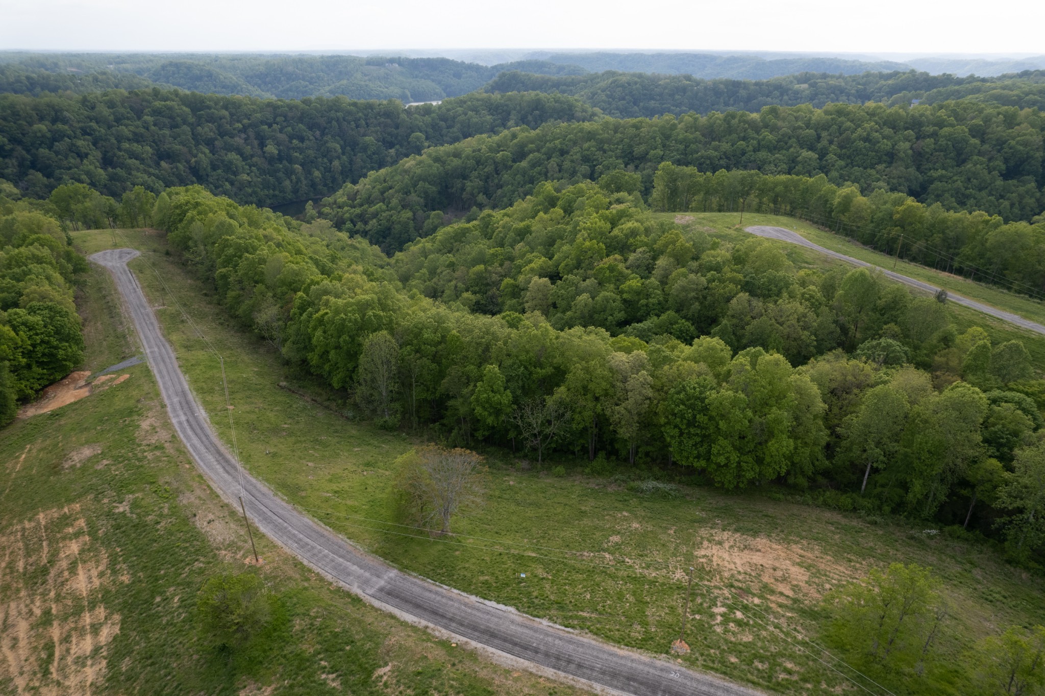 36 Eli Lane Baxter, TN 38544 - Photo 3 of 3 a view of a lake with huge green field and trees