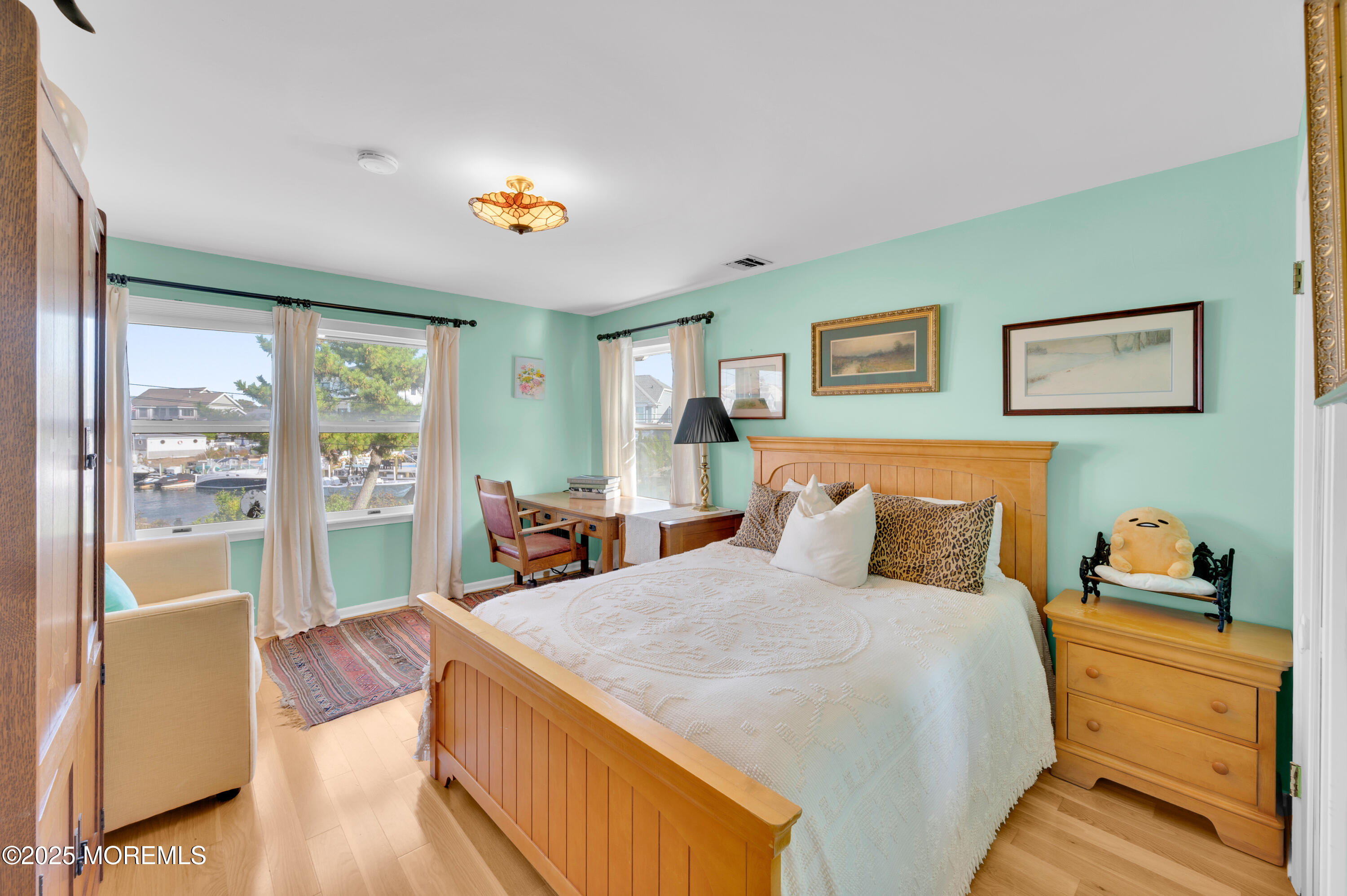 1700 Rue Mirador Point Pleasant, NJ 08742 - Photo 58 of 63 a bedroom with a bed and a large window