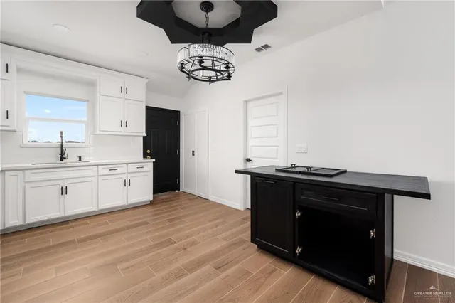 a kitchen with a stove and a white refrigerator