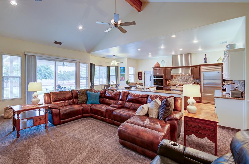 17465 Monreal Road Madera, CA 93636 - Photo 22 of 59 a living room with furniture kitchen view and a large window