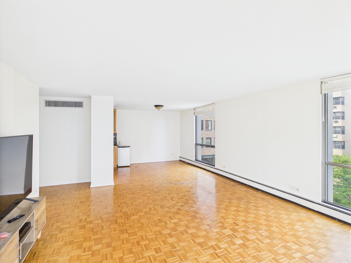 1310 North Ritchie Court, Unit 7D Chicago, IL 60610 - Photo 16 of 38 an empty room with a natural light