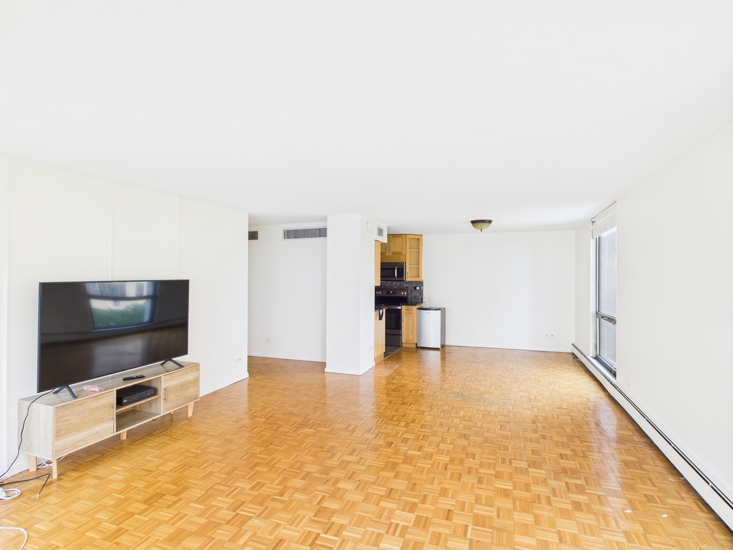 1310 North Ritchie Court, Unit 7D Chicago, IL 60610 - Photo 17 of 38 a living room with a flat screen tv and furniture