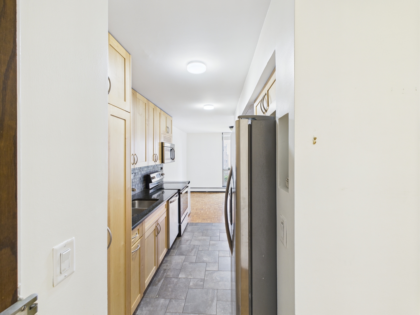 1310 North Ritchie Court, Unit 7D Chicago, IL 60610 - Photo 21 of 38 a kitchen with a refrigerator and a sink