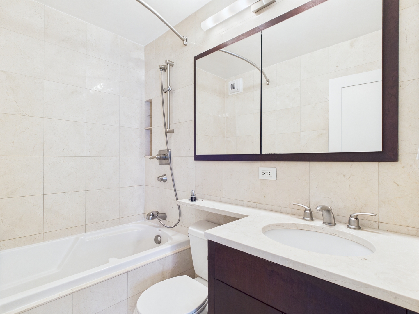 1310 North Ritchie Court, Unit 7D Chicago, IL 60610 - Photo 33 of 38 a bathroom with a sink toilet tub and shower