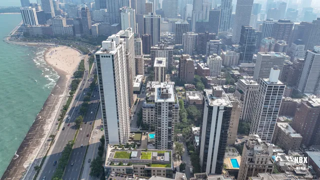 a view of multiple houses with yard