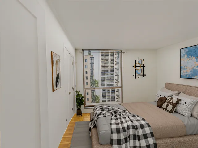 a bedroom with a bed and a window