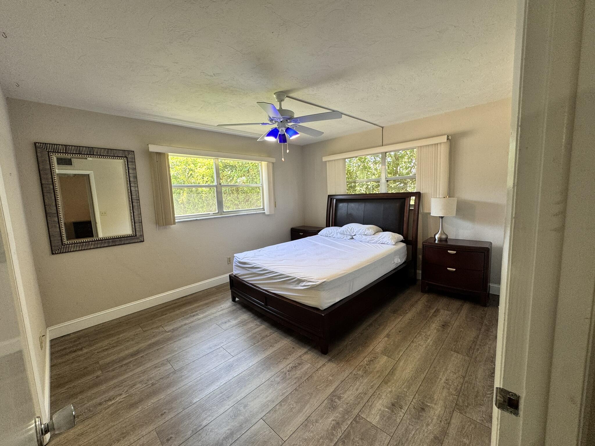 3124 Highway 441, Unit J1 Okeechobee, FL 34974 - Photo 14 of 40 a bedroom with a bed and window