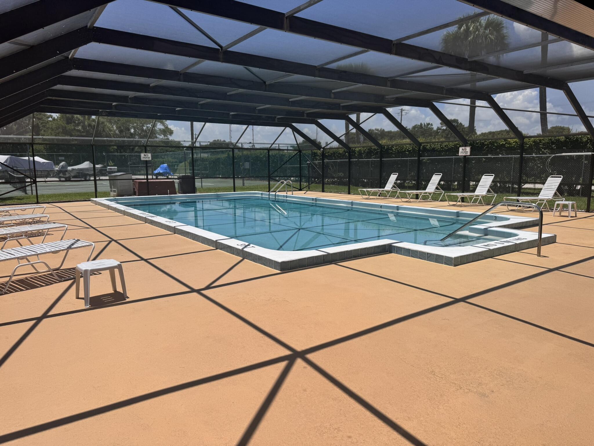 3124 Highway 441, Unit J1 Okeechobee, FL 34974 - Photo 34 of 40 a view of a swimming pool with a patio
