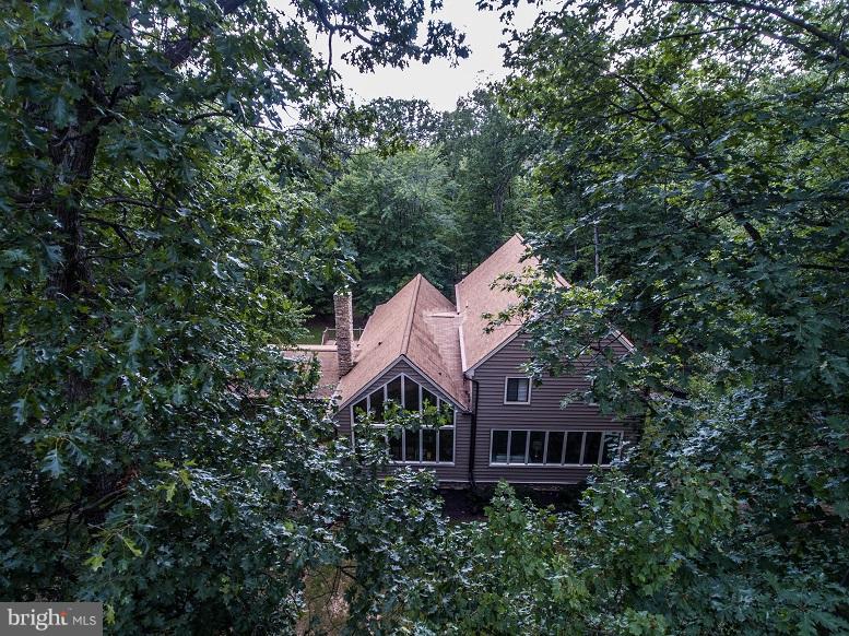 6123 Davis Road Woodbine, MD 21797 - Photo 2 of 30 a front view of a house with a yard and garage