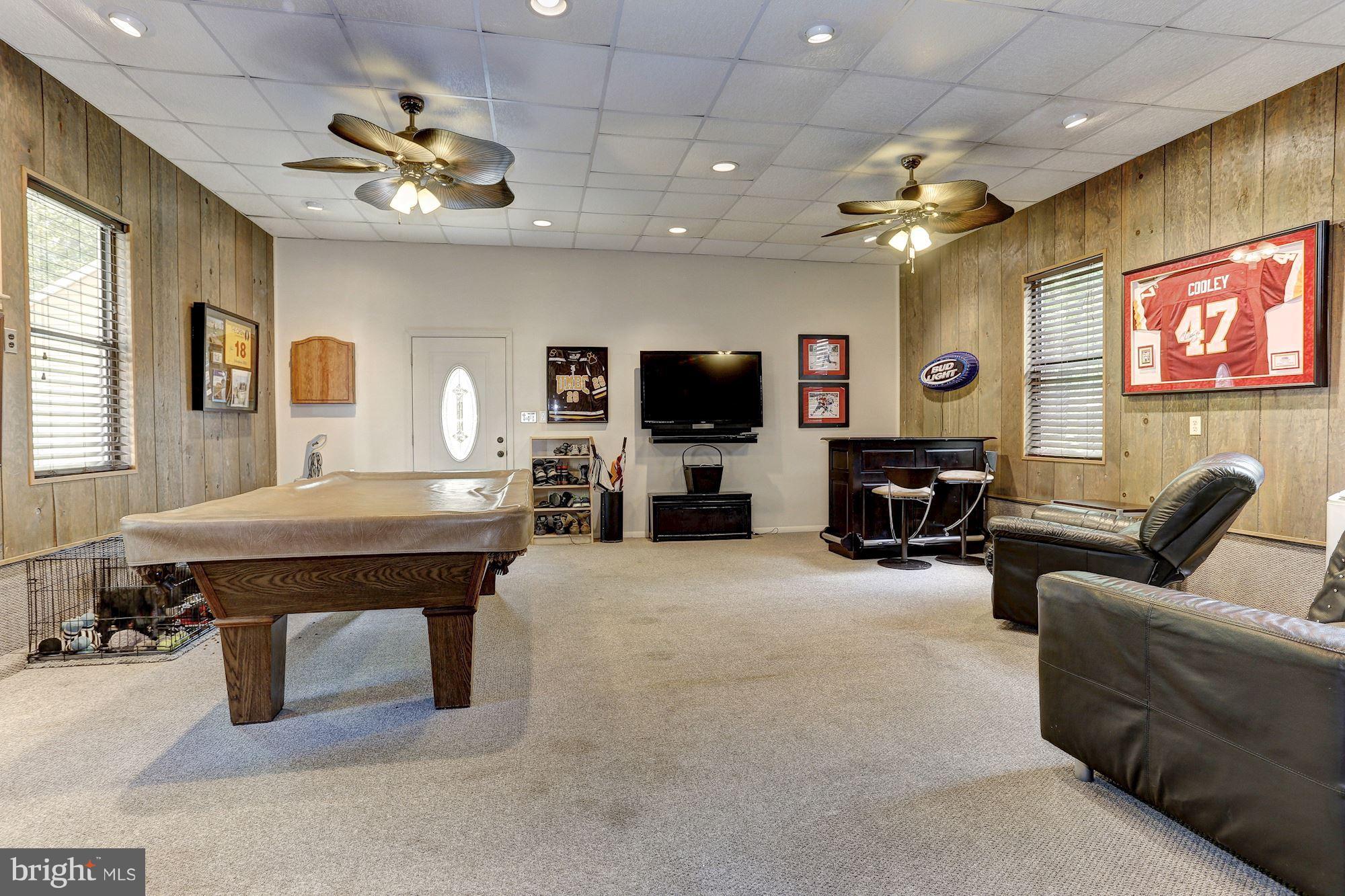 6123 Davis Road Woodbine, MD 21797 - Photo 20 of 30 a living room with furniture and a flat screen tv