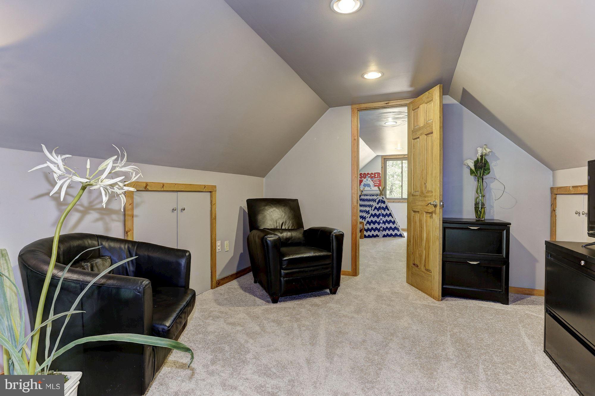 6123 Davis Road Woodbine, MD 21797 - Photo 21 of 30 a living room with furniture and a flat screen tv