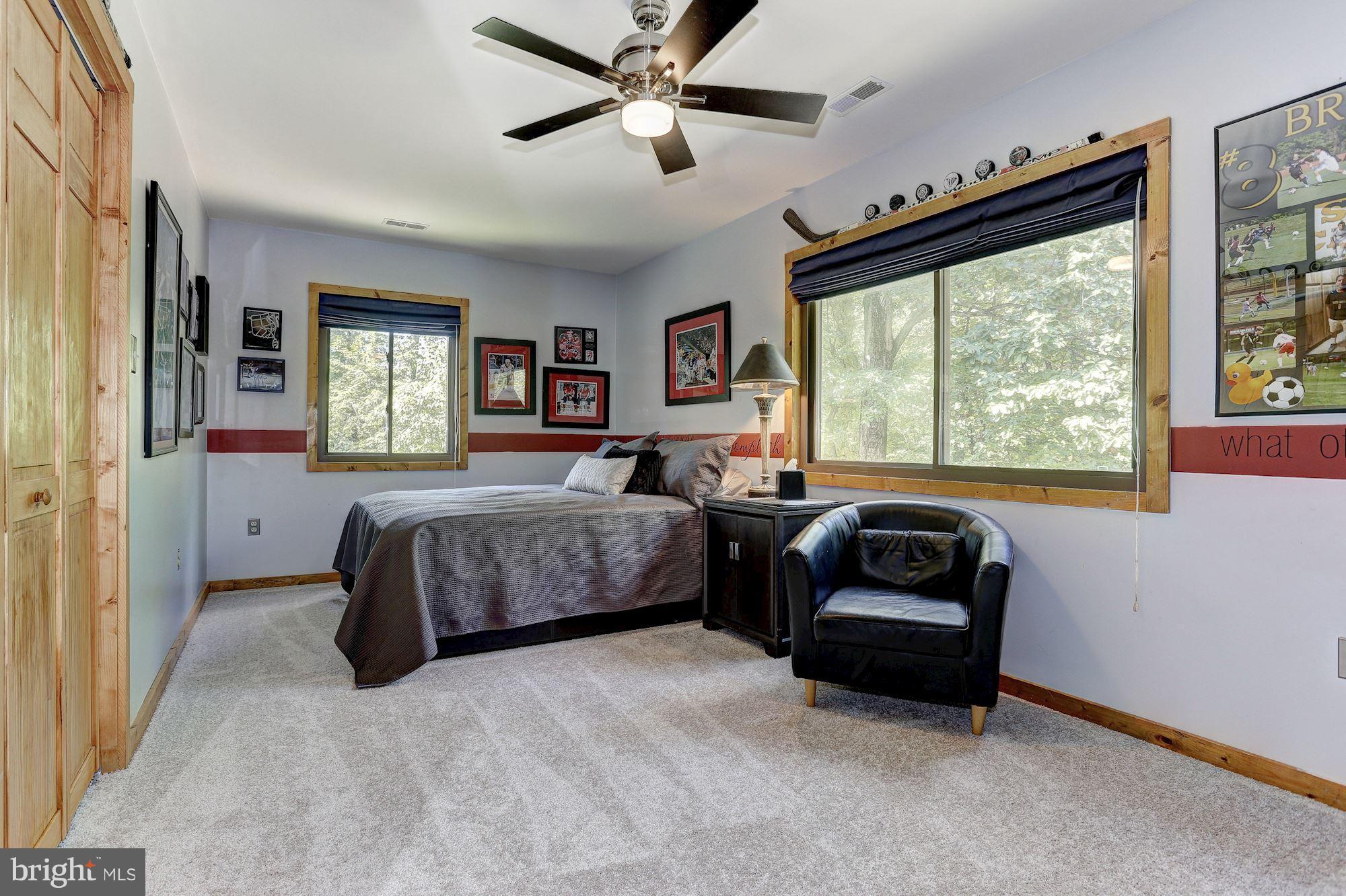 6123 Davis Road Woodbine, MD 21797 - Photo 24 of 30 a bedroom with a bed and a couch