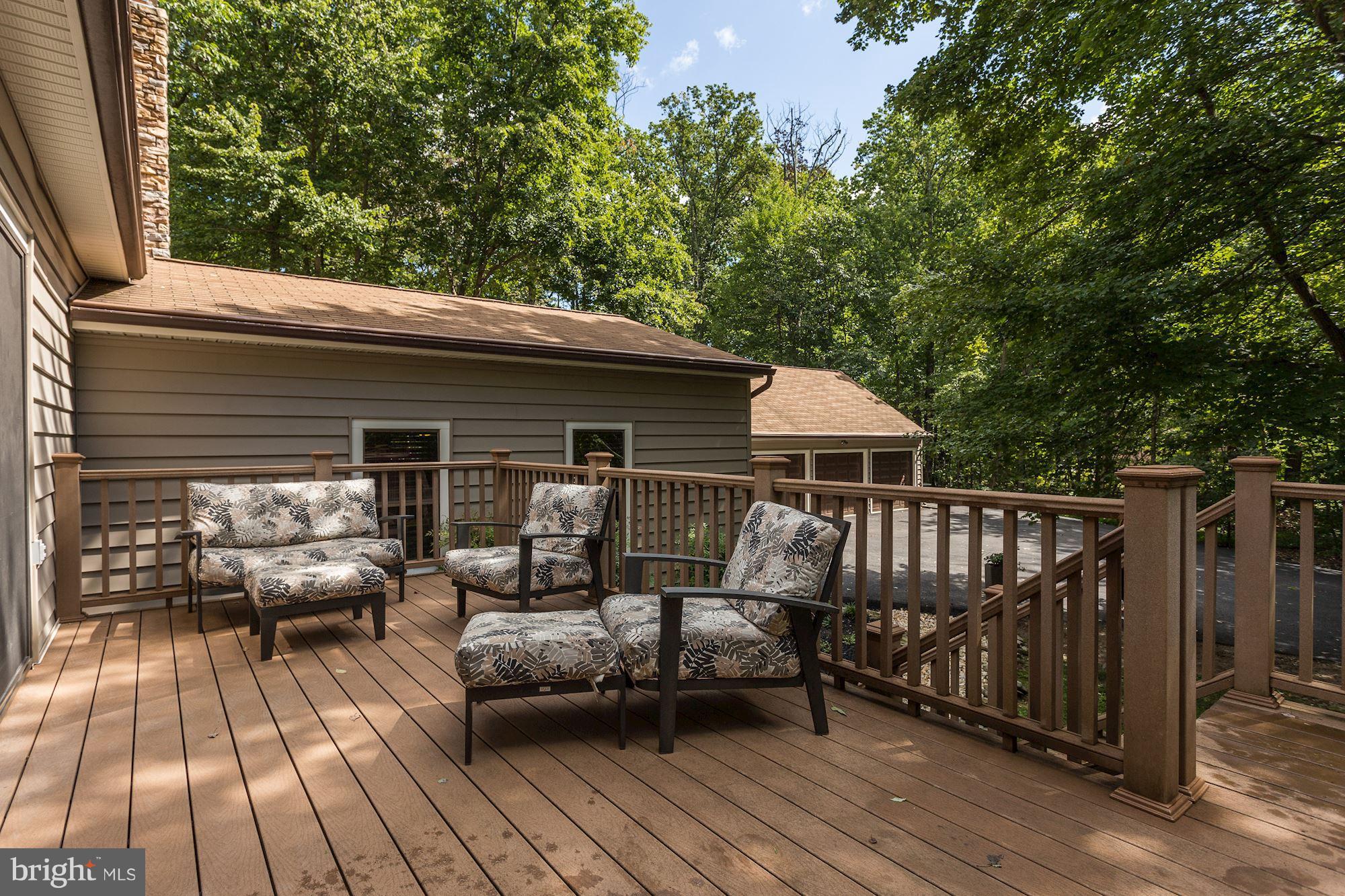 6123 Davis Road Woodbine, MD 21797 - Photo 29 of 30 a view of a wooden deck with furniture