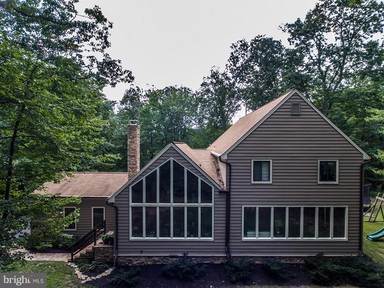 6123 Davis Road Woodbine, MD 21797 - Photo 4 of 30 a front view of a house with a yard