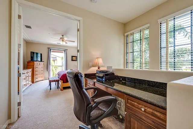 a bedroom with furniture and a window