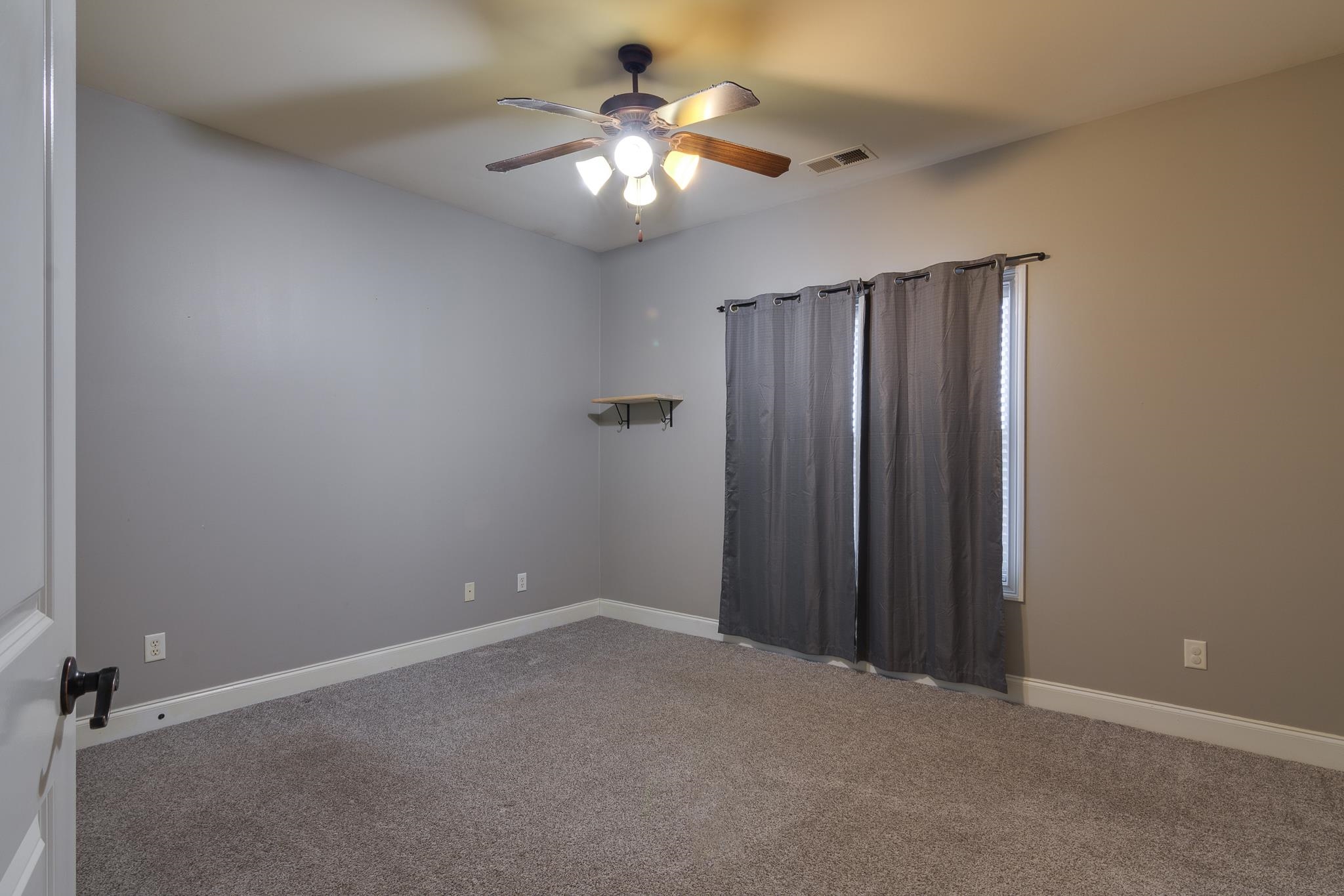 43 Tipton Rdg Cove Munford, TN 38058 - Photo 19 of 30 Unfurnished room featuring ceiling fan and carpet flooring