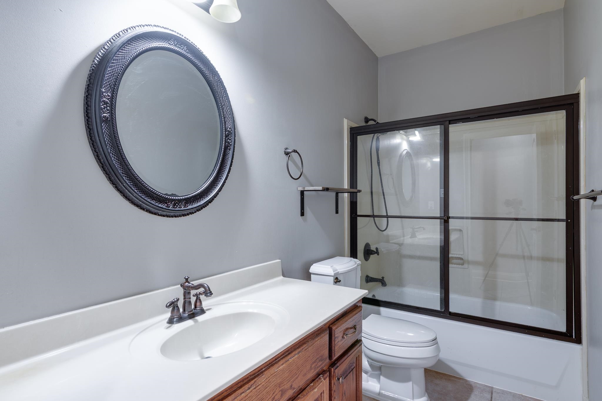 43 Tipton Rdg Cove Munford, TN 38058 - Photo 21 of 30 a bathroom with a toilet a sink and a mirror