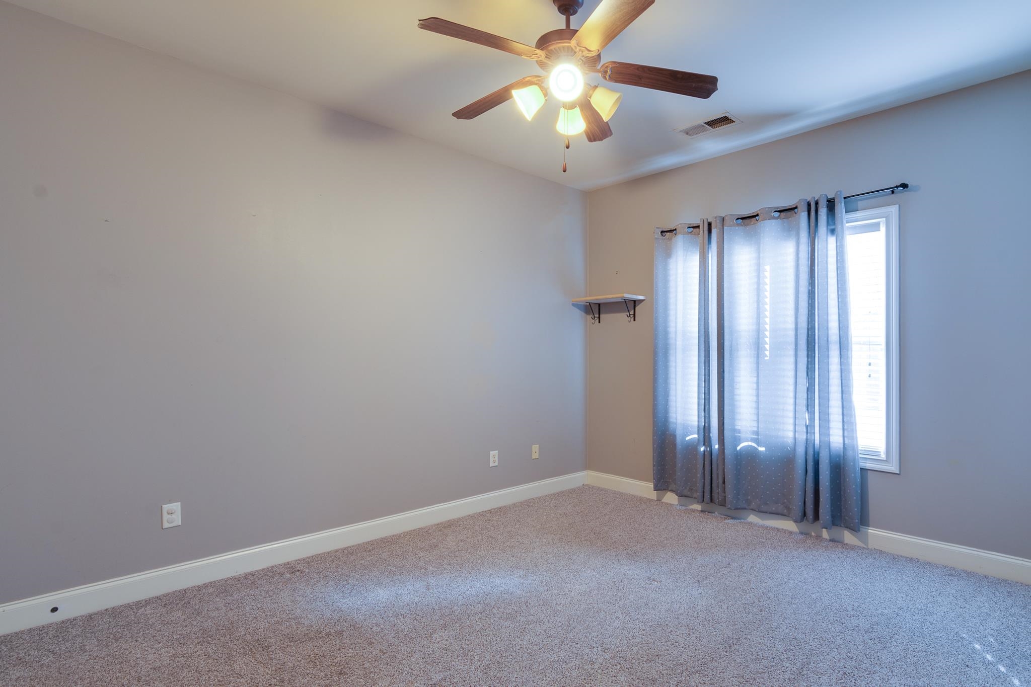 43 Tipton Rdg Cove Munford, TN 38058 - Photo 22 of 30 an empty room with chandelier fan