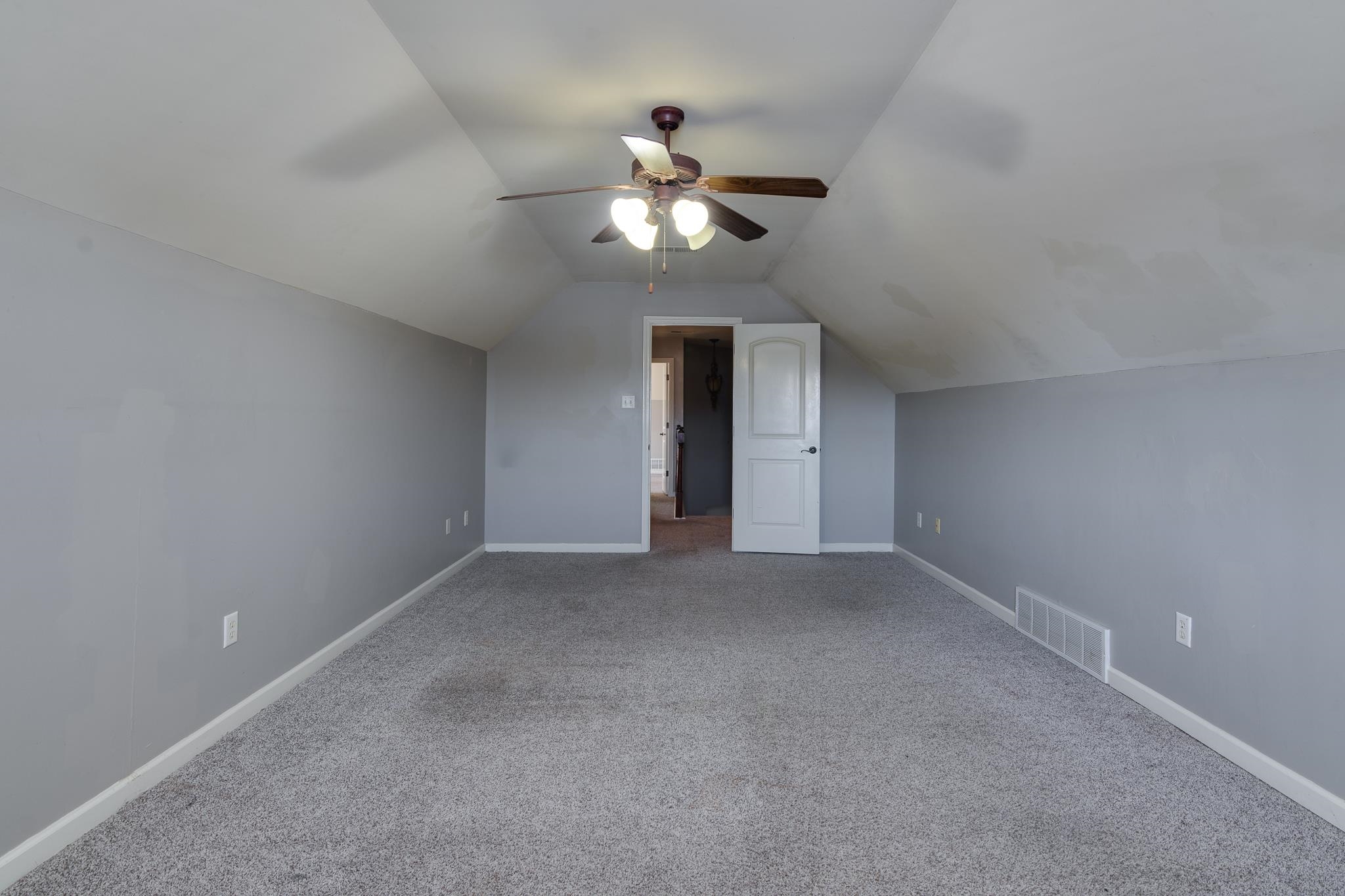43 Tipton Rdg Cove Munford, TN 38058 - Photo 25 of 30 a view of an empty room with a ceiling fan and window